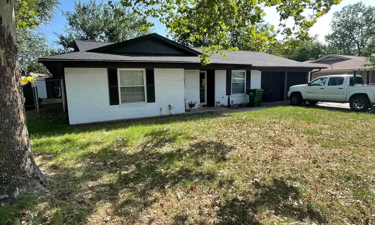 Professional roofing crew working on a residential roof in Lancaster